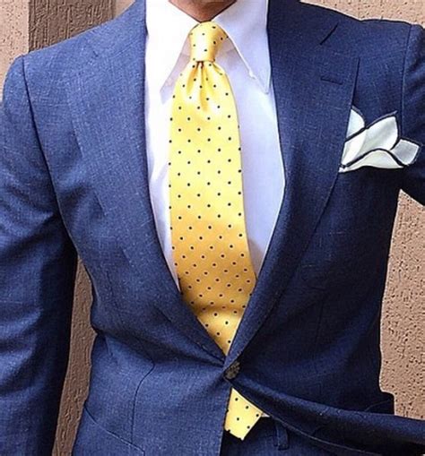 yellow tie with navy suit